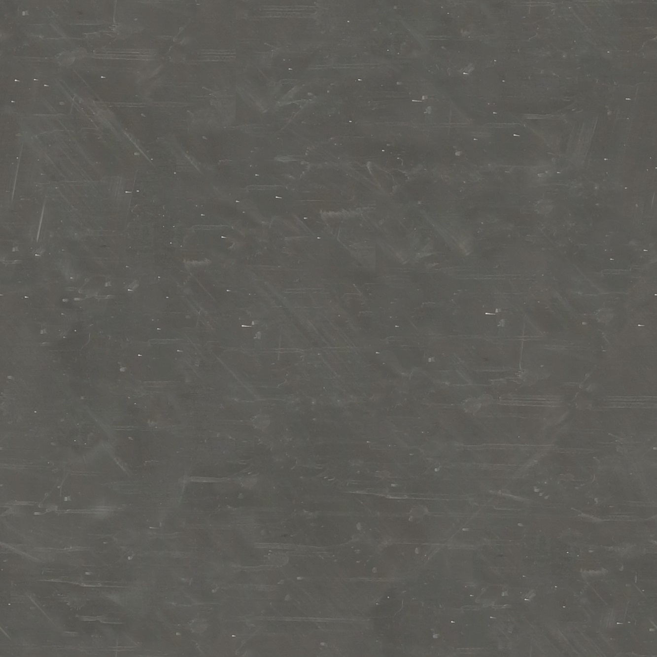 Dark scratched stainless steel surface.